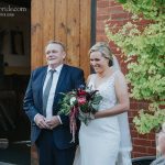 Bride walks down the aisle with her Dad